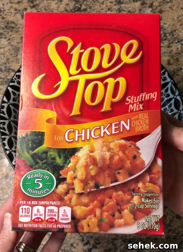 Cheesy Chicken and Herb Stuffing Casserole 5 Mixing stuffing