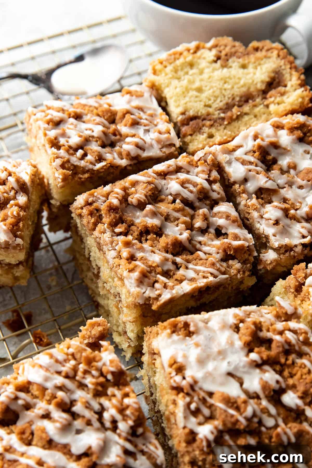 Streusel-Topped Coffee Cake Bars Recipe for Perfect Morning Treat 8 coffee cake bars on a cooling rack.