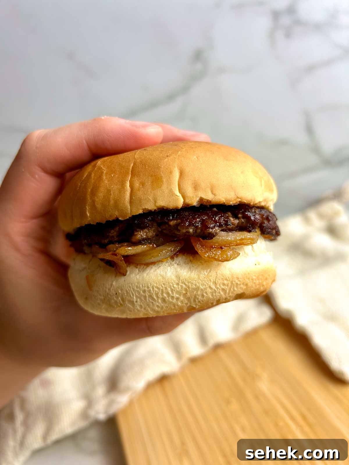 hand holding buddy burger