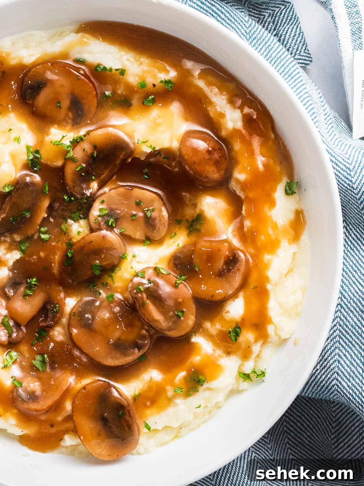 Creamy Mushroom Gravy Recipe for Steaks and Mashed Potatoes 6 Mushroom gravy over mashed potatoes.