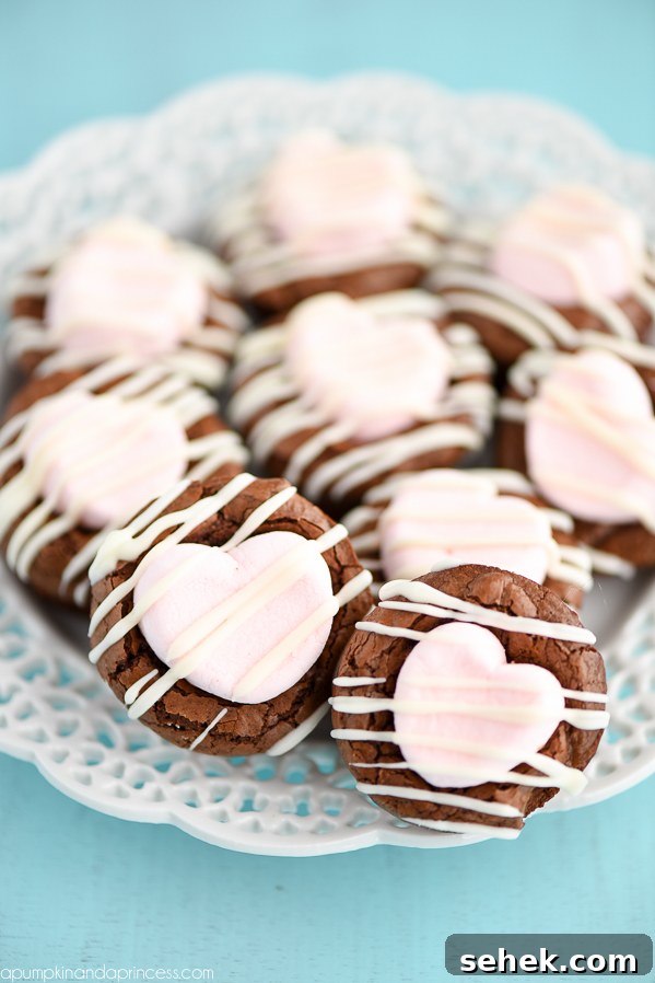 Chocolate-Covered Oreo Heart Cookies: Valentine's Treat Recipe 7 Marshmallow Brownie Bites Recipe - mini brownies topped with strawberry marshmallows and white chocolate