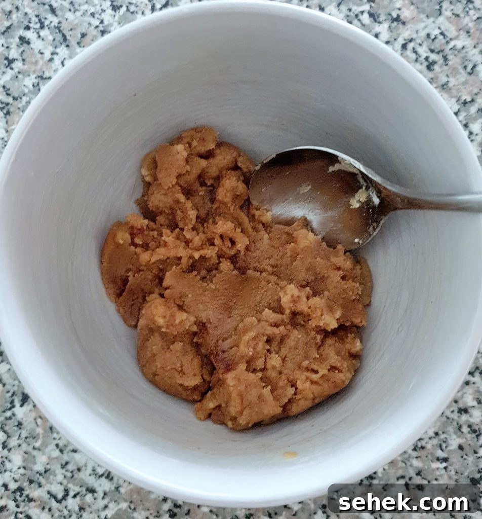 Fluffy Apple Cinnamon Muffins with Streusel Topping 12 crumb mixture in a bowl.