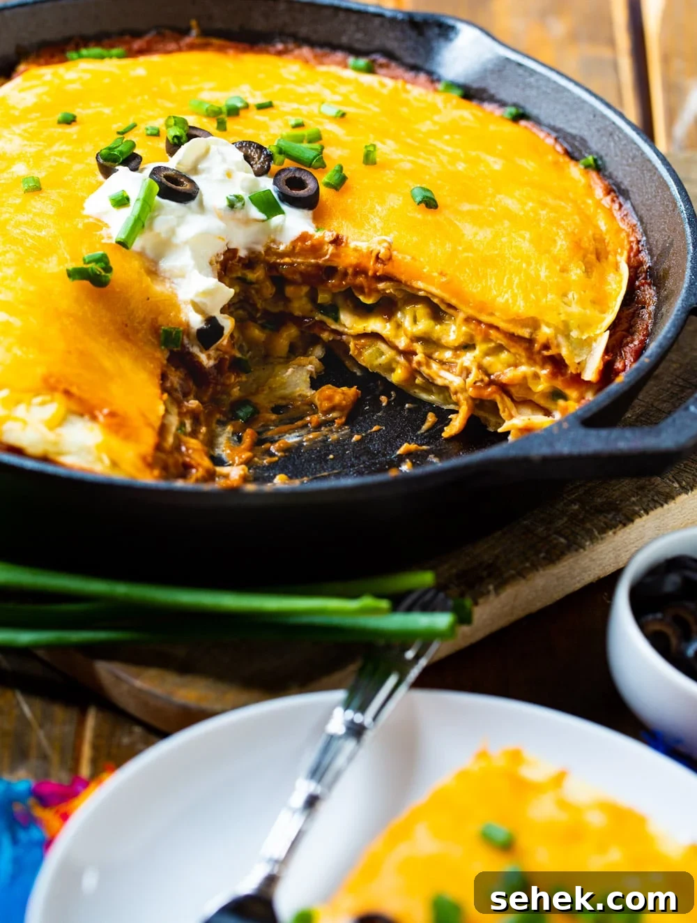 One-Pan Chicken Tortilla Pie Recipe for Quick Weeknight Dinners 4 Chicken Tortilla Pie with a slice cut out.