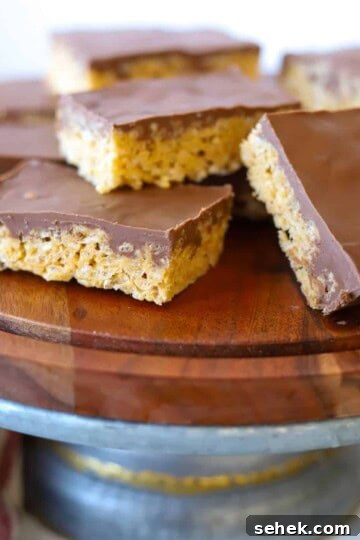 Peanut butter rice krispie treats on platter.