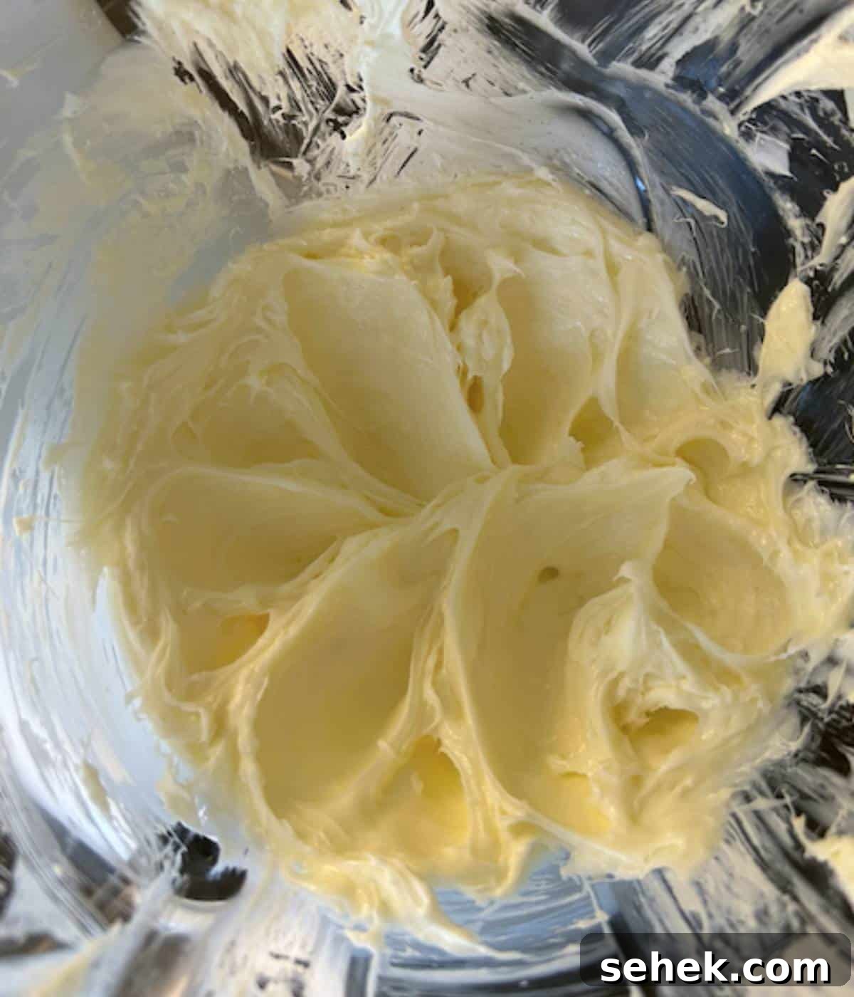 Cream cheese and sugar in stand mixer.