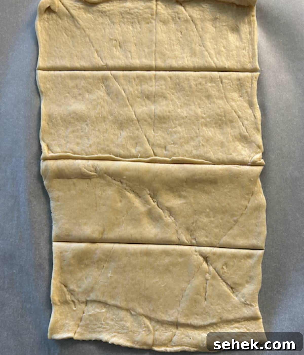 Crescent dough cut into 4 equal slices.