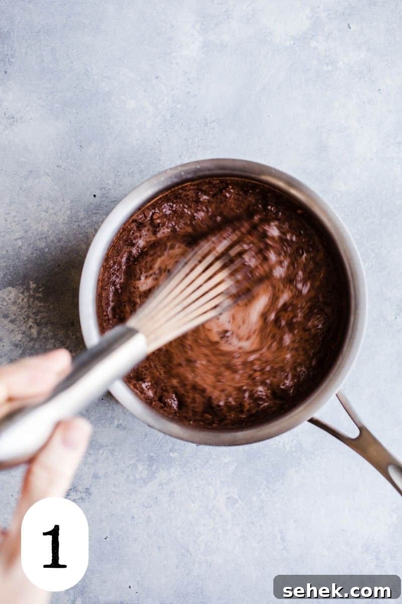 Cocoa powder and milk in a saucepan.