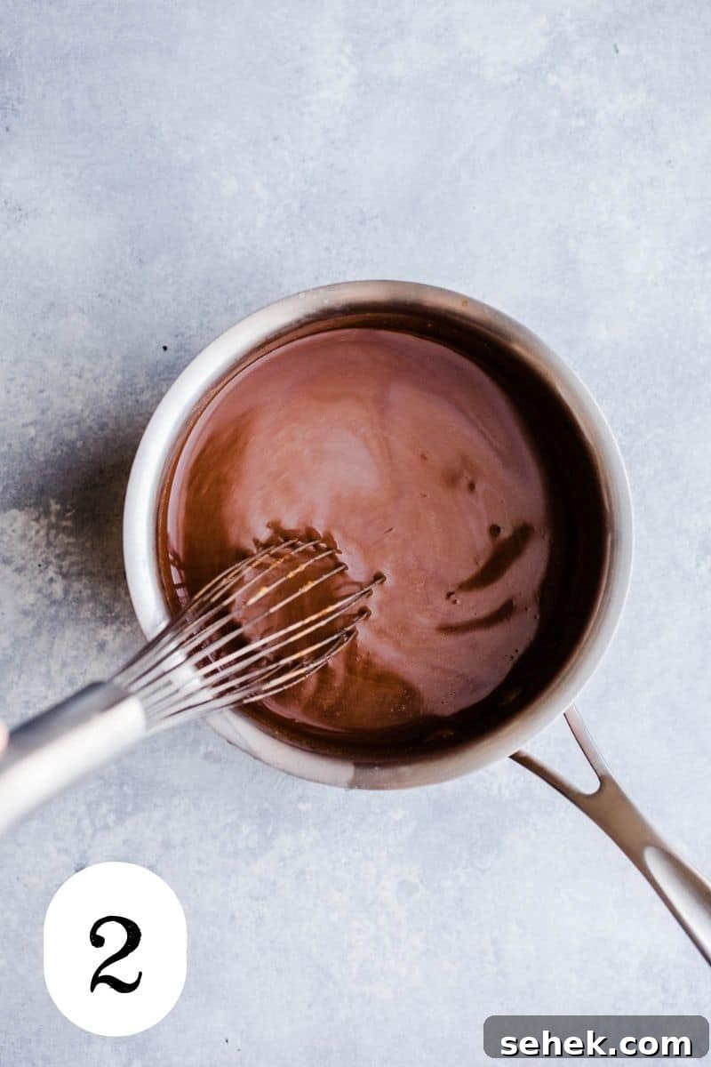 Hot cocoa in a small saucepan.