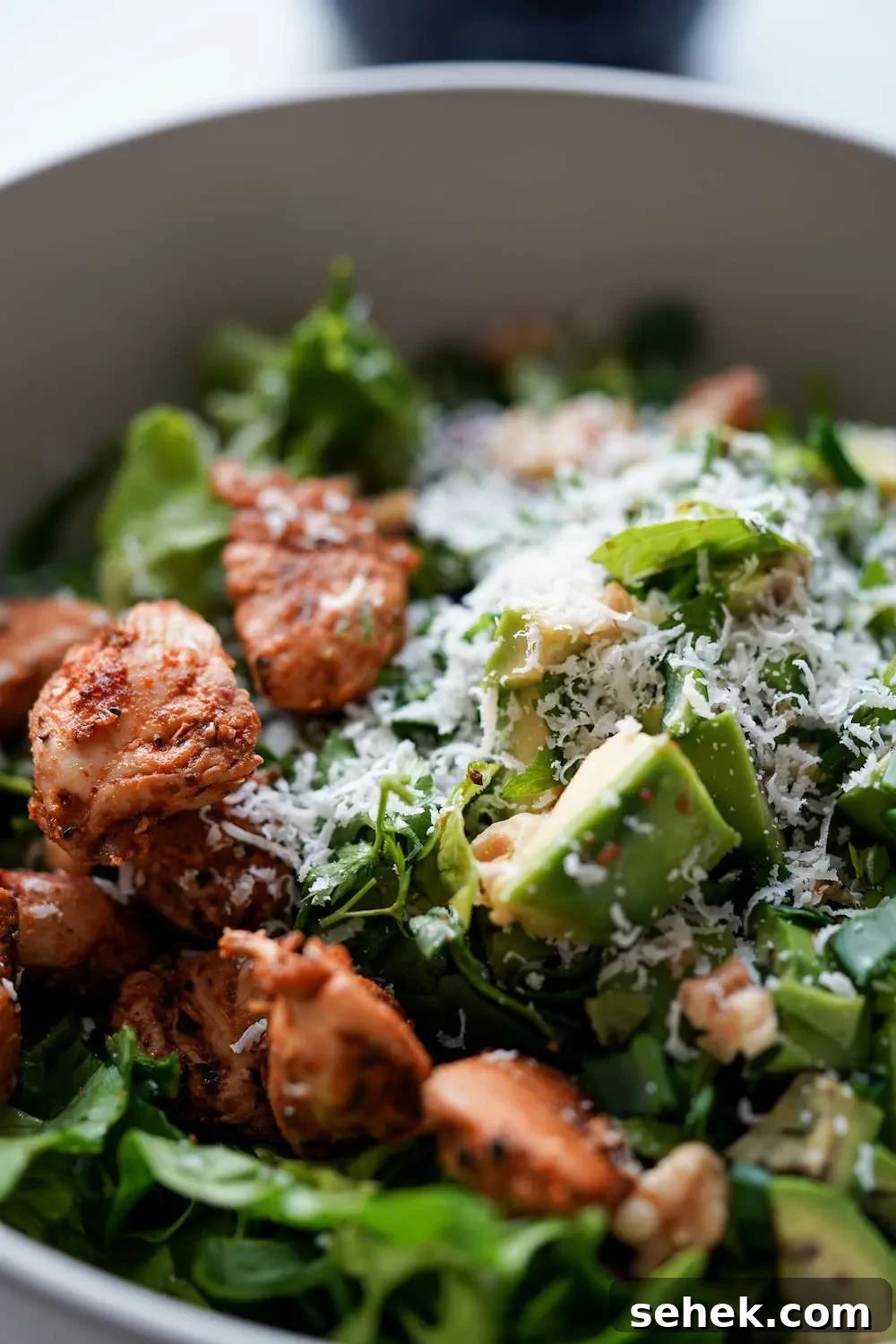 This low-carb chicken salad with creamy yogurt dressing is packed with leafy greens and avocado! Add some walnuts and toasted sesame seeds for extra crunch, you do not need croutons! This healthy salad recipe is the perfect way to use chicken breast and it’s high-fiber high-protein and low in carbs, perfect for meal prep too! Enjoy for lunch or dinner!