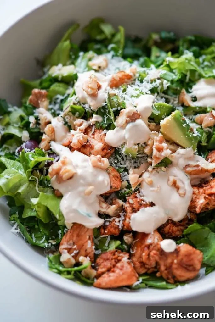 This low-carb chicken salad with creamy yogurt dressing is packed with leafy greens and avocado! Add some walnuts and toasted sesame seeds for extra crunch, you do not need croutons! This healthy salad recipe is the perfect way to use chicken breast and it’s high-fiber high-protein and low in carbs, perfect for meal prep too! Enjoy for lunch or dinner!