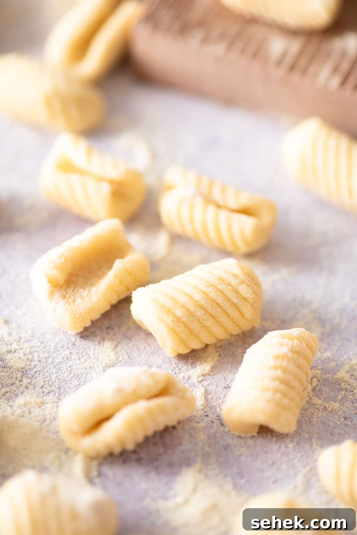 How to Make Gnocchetti Sardi (Malloreddus) — Authentic Sardinian Recipe 8 A close up of Gnocchetti Sardi pasta on a work surface