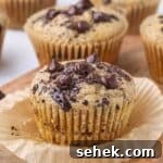 Greek Yogurt Chocolate Chip Muffins — Moist, Protein-Packed Recipe 9 Chocolate chip muffins on a cutting board.