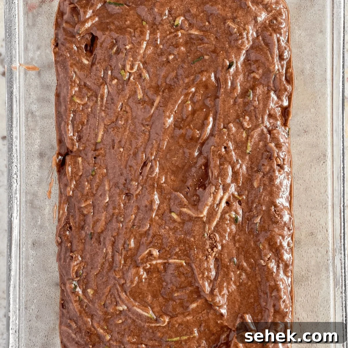 Moist Chocolate Zucchini Bread Recipe You’ll Love 3 chocolate zucchini bread batter in a bread pan.