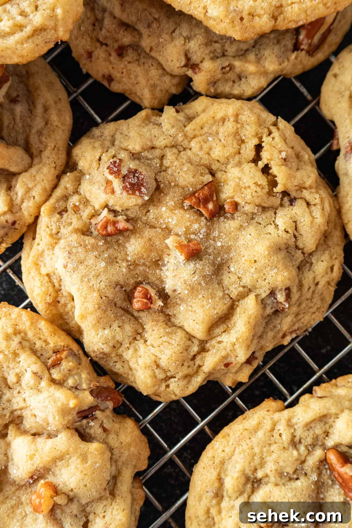 Pecan Pie Cookies: Chewy Cinnamon-Pecan Cookie Recipe 2 pecan pie cookie with sugar crystals on cooling rack.
