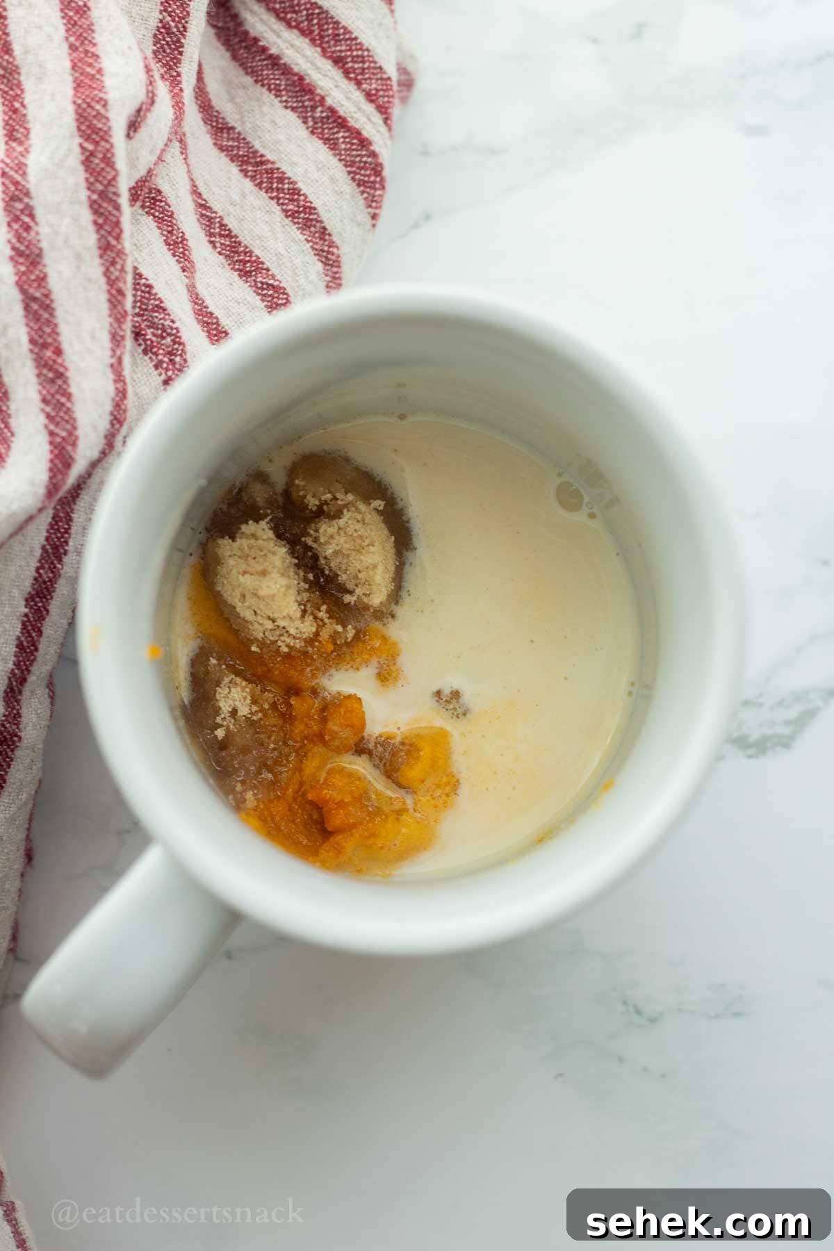 Quick Pumpkin Spice Mug Cake Recipe for One 4 Wet ingredients in mug.