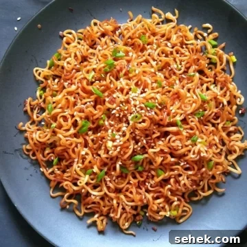 10-Minute Sesame Garlic Ramen Recipe for Fast Flavor 7 Image showing sesame garlic noodles served on a black plate.