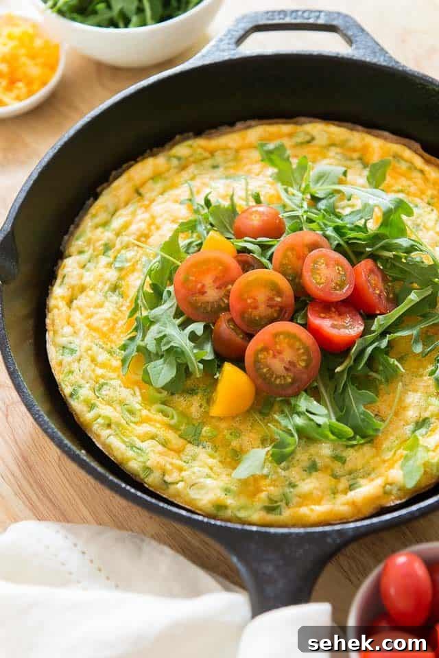 Crispy Potato Frittata with Caramelized Onions and Herbs 2 Potato Frittata - in Cast Iron Skillet with Tomatoes and Arugula