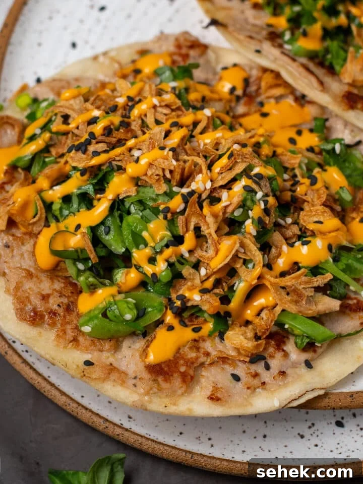 seared ahi tuna taco with snap pea filling, crispy shallots and sriracha mayo