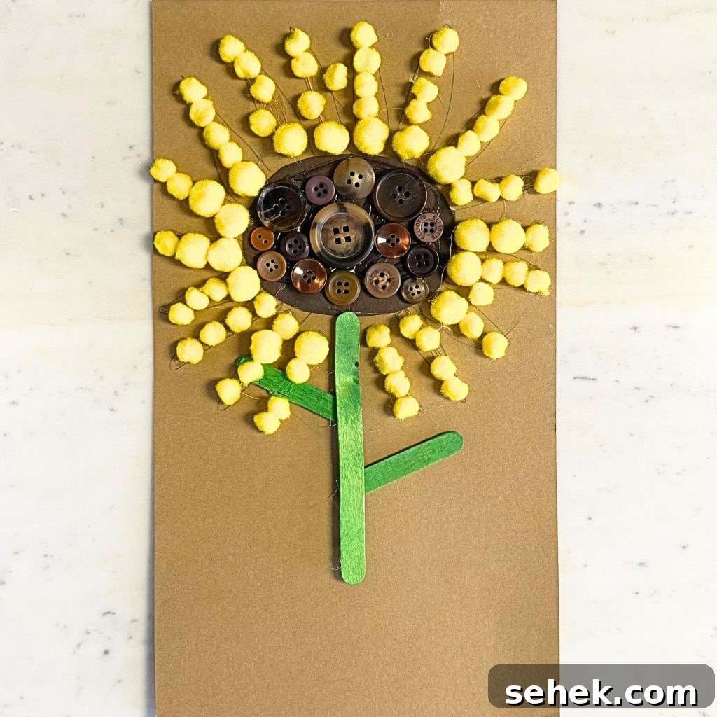 DIY Paper Sunflower with Pom-Pom Center: Step-by-Step Craft Tutorial 12 Finished sunflower displayed