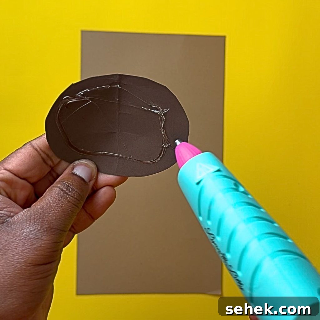 DIY Paper Sunflower with Pom-Pom Center: Step-by-Step Craft Tutorial 4 Gluing center to background