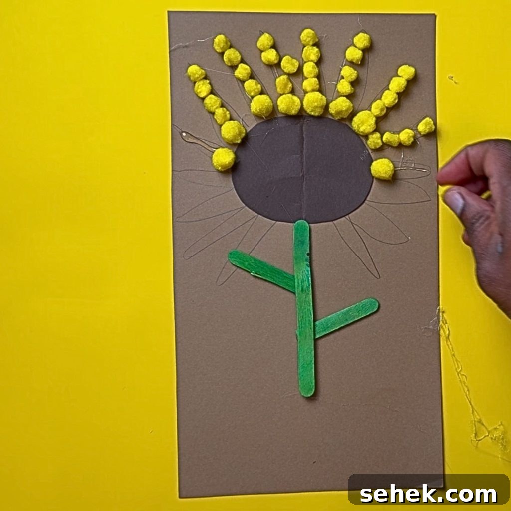 DIY Paper Sunflower with Pom-Pom Center: Step-by-Step Craft Tutorial 10 Close-up of pom pom petals