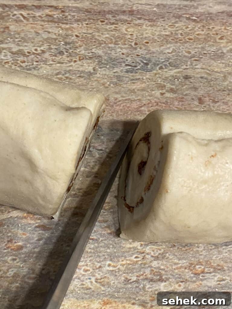 Quick Crescent Roll Cinnamon Buns: 20-Minute Sticky Rolls 11 process shot of slicing dough