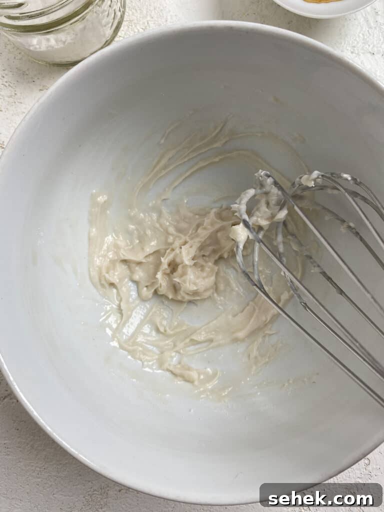 Quick Crescent Roll Cinnamon Buns: 20-Minute Sticky Rolls 14 process shot of mixing icing ingredients in bowl with whisk