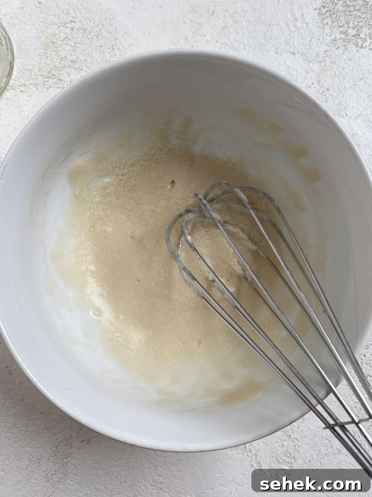 Quick Crescent Roll Cinnamon Buns: 20-Minute Sticky Rolls 15 process shot of mixing icing ingredients in bowl with whisk
