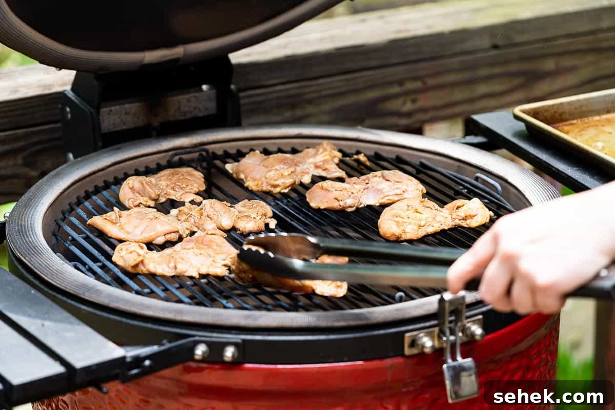 Balsamic Grilled Chicken with Garlic and Herbs 9 tongs placing chicken on grill