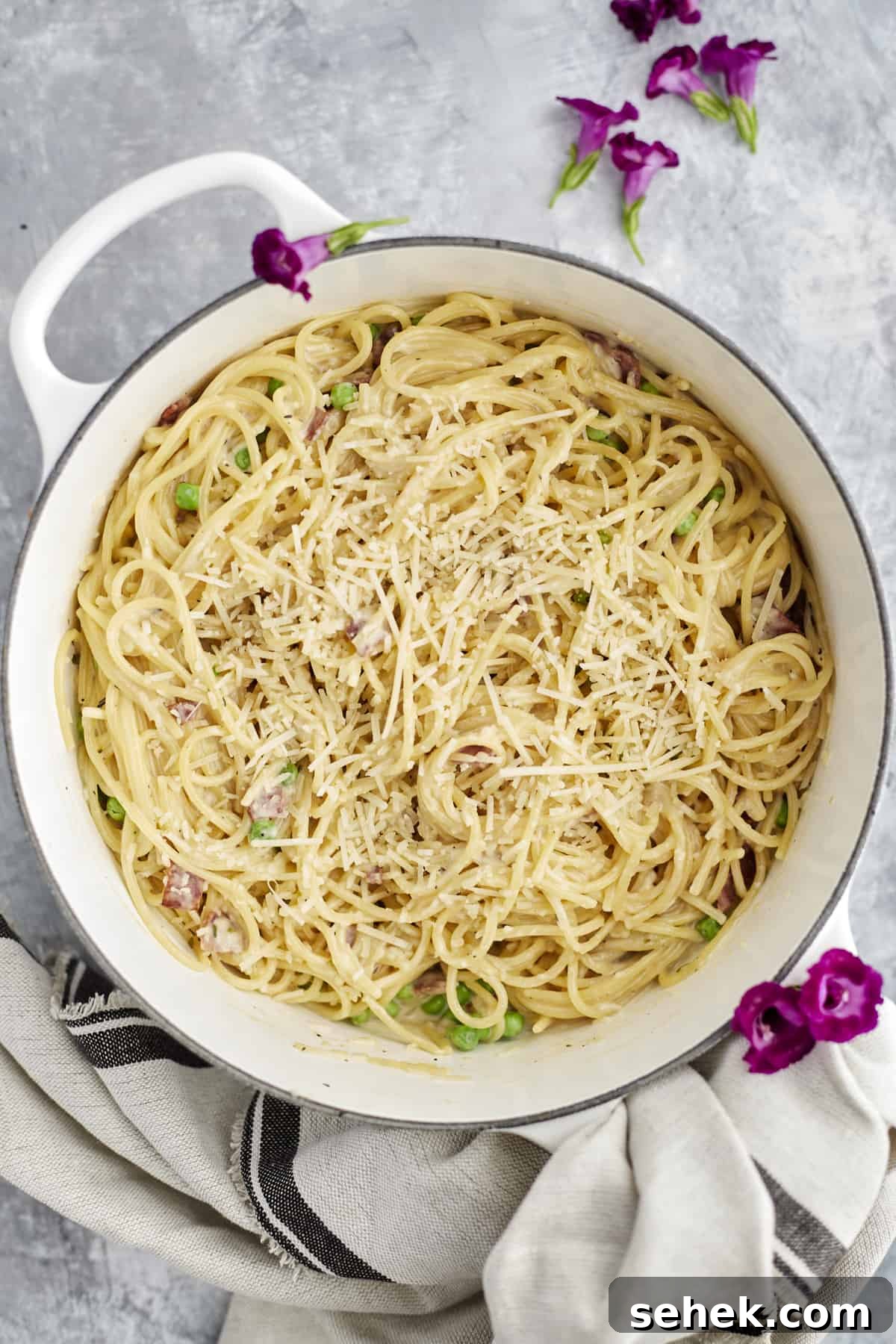 One-Pot Spaghetti Carbonara: Quick Creamy Classic Recipe 2 one pot spaghetti carbonara in a white pot topped with parmesan cheese
