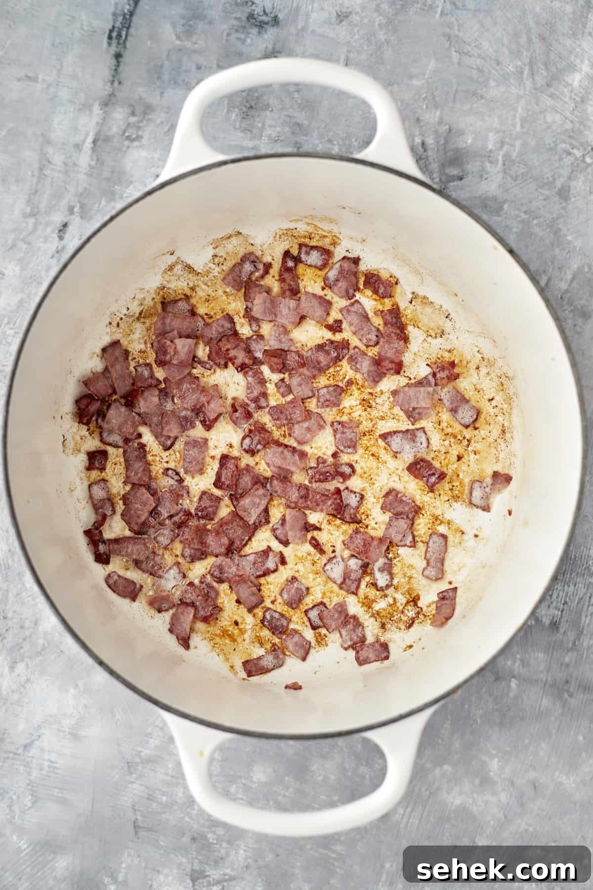 One-Pot Spaghetti Carbonara: Quick Creamy Classic Recipe 3 bacon cooking in the bottom of a pot