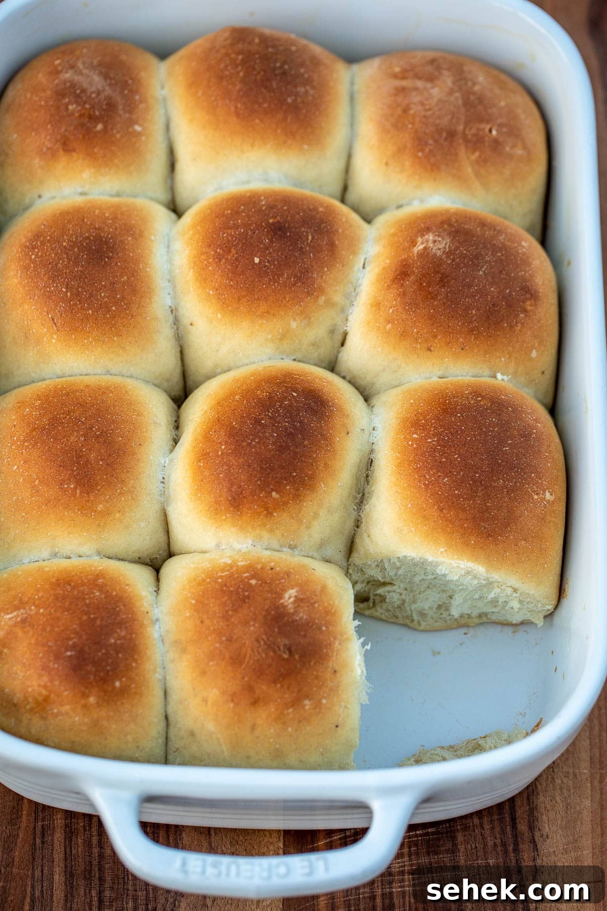 Banana Bread Rolls Recipe: Soft, Cinnamon-Swirled Breakfast Buns 4 Bread rolls in a pan with one missing