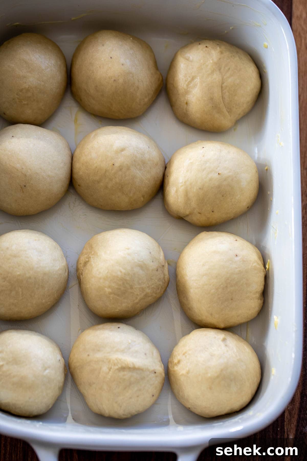 Banana Bread Rolls Recipe: Soft, Cinnamon-Swirled Breakfast Buns 5 Bread Rolls formed into a ball and placed in a baking dish