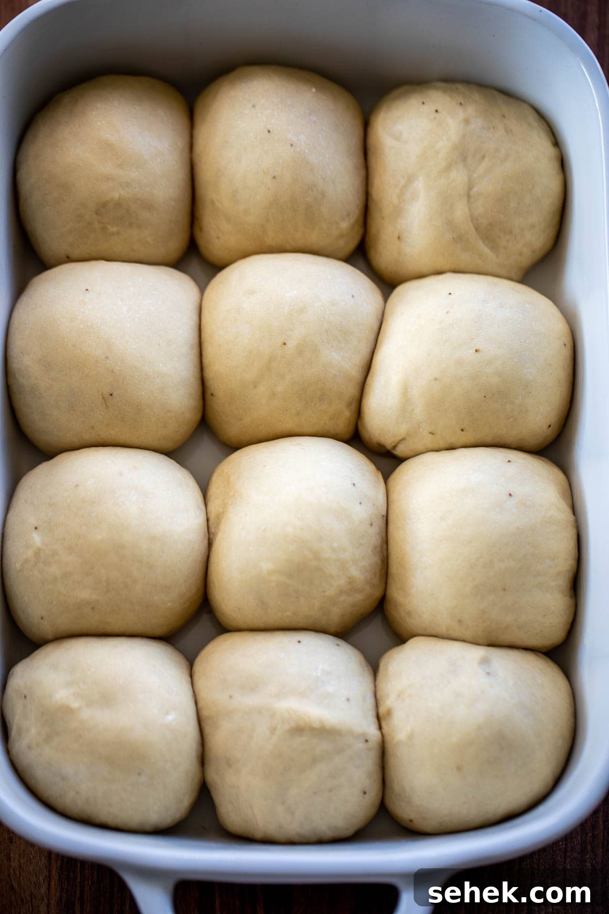 Banana Bread Rolls Recipe: Soft, Cinnamon-Swirled Breakfast Buns 6 Pan filled with risen rolls