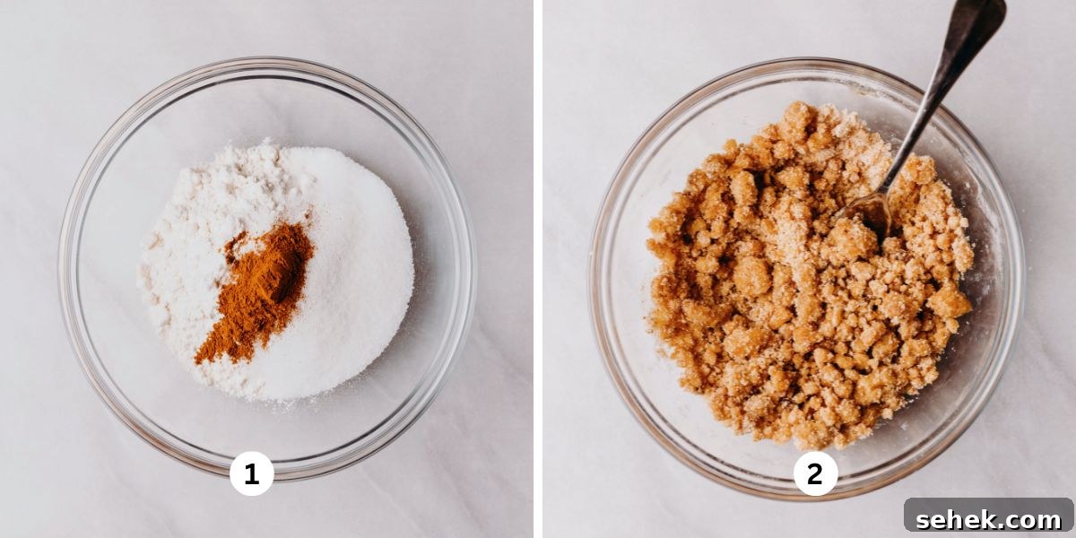 Whisking all-purpose flour, sugar, and cinnamon together then adding in the cubed cold butter in glass bowl on a white background.