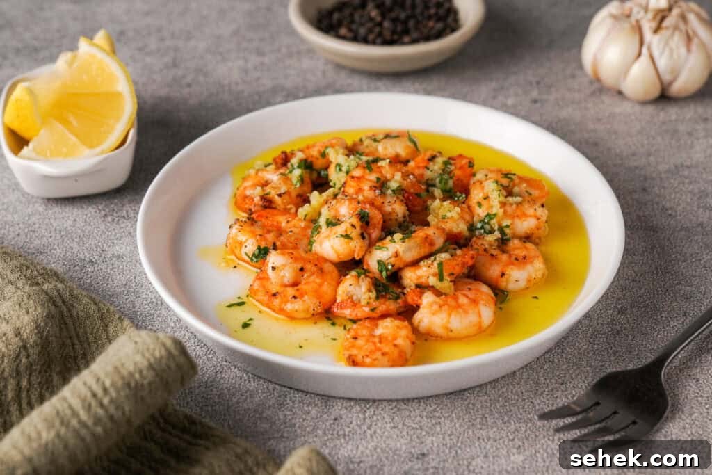 Garlic Butter Shrimp in the Air Fryer: Quick Crispy Recipe 2 Air fryer shrimp on plate