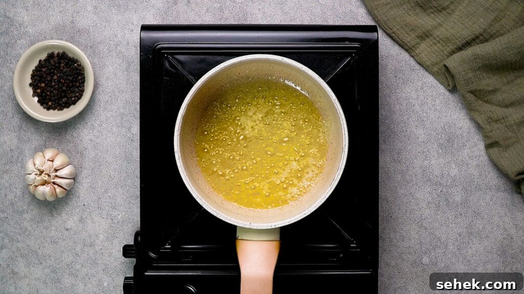 Garlic Butter Shrimp in the Air Fryer: Quick Crispy Recipe 11 Melt butter with garlic in the pan