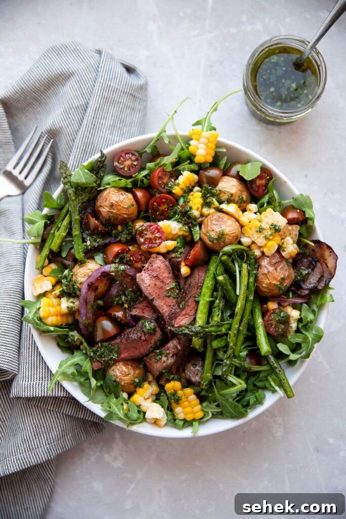 Chimichurri Steak & Roasted Vegetable Salad Recipe 2 steak salad with chimichurri asparagus corn tomatoes onion in a white bowl