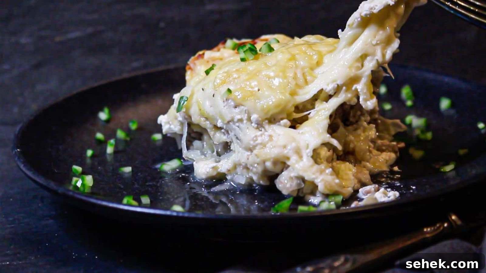 17 Cozy Casseroles for Any Night of the Week 11 Eating a casserole on a plate with fork.