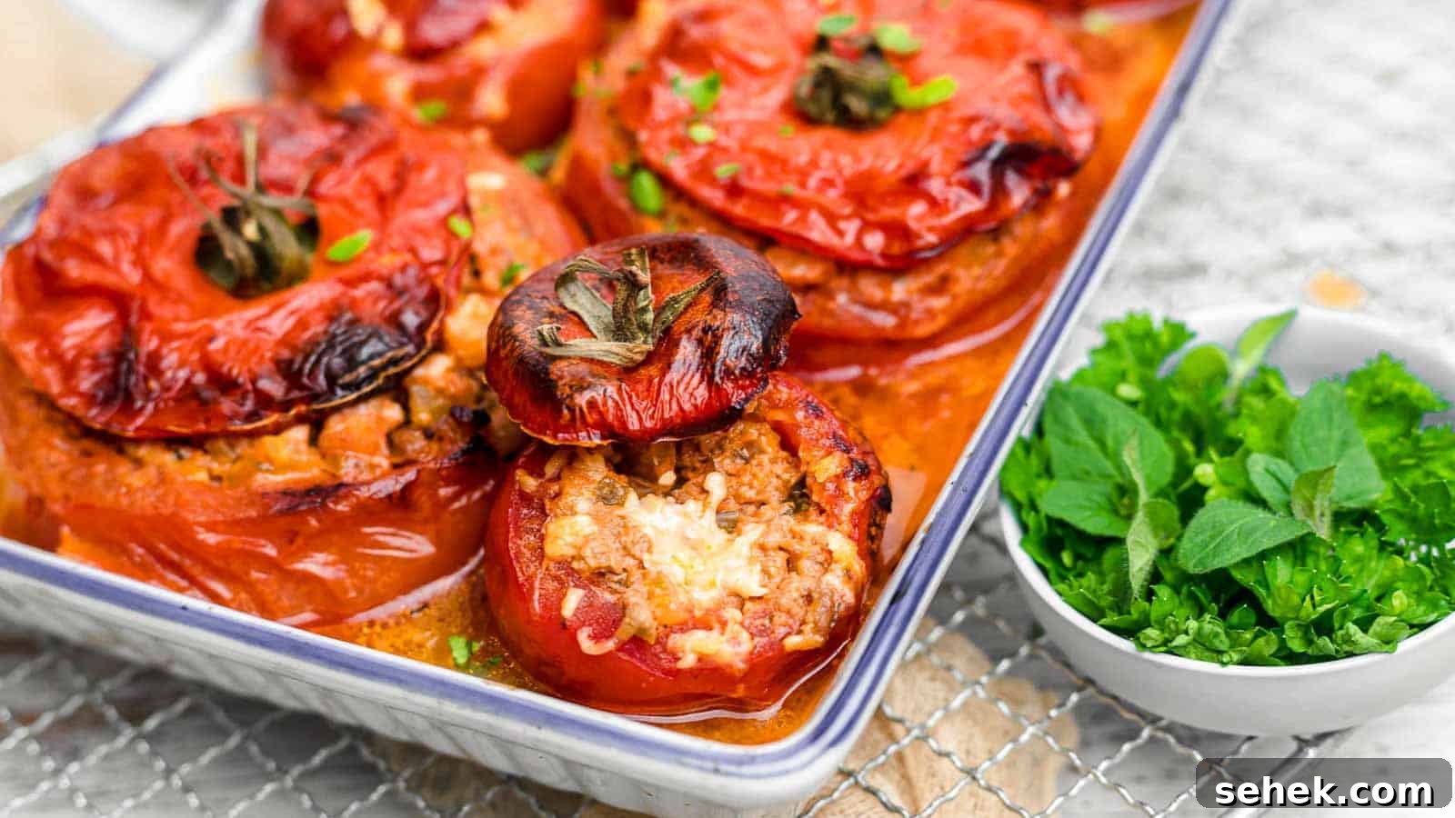 17 Cozy Casseroles for Any Night of the Week 10 Stuffed Tomatoes inside white casserole.