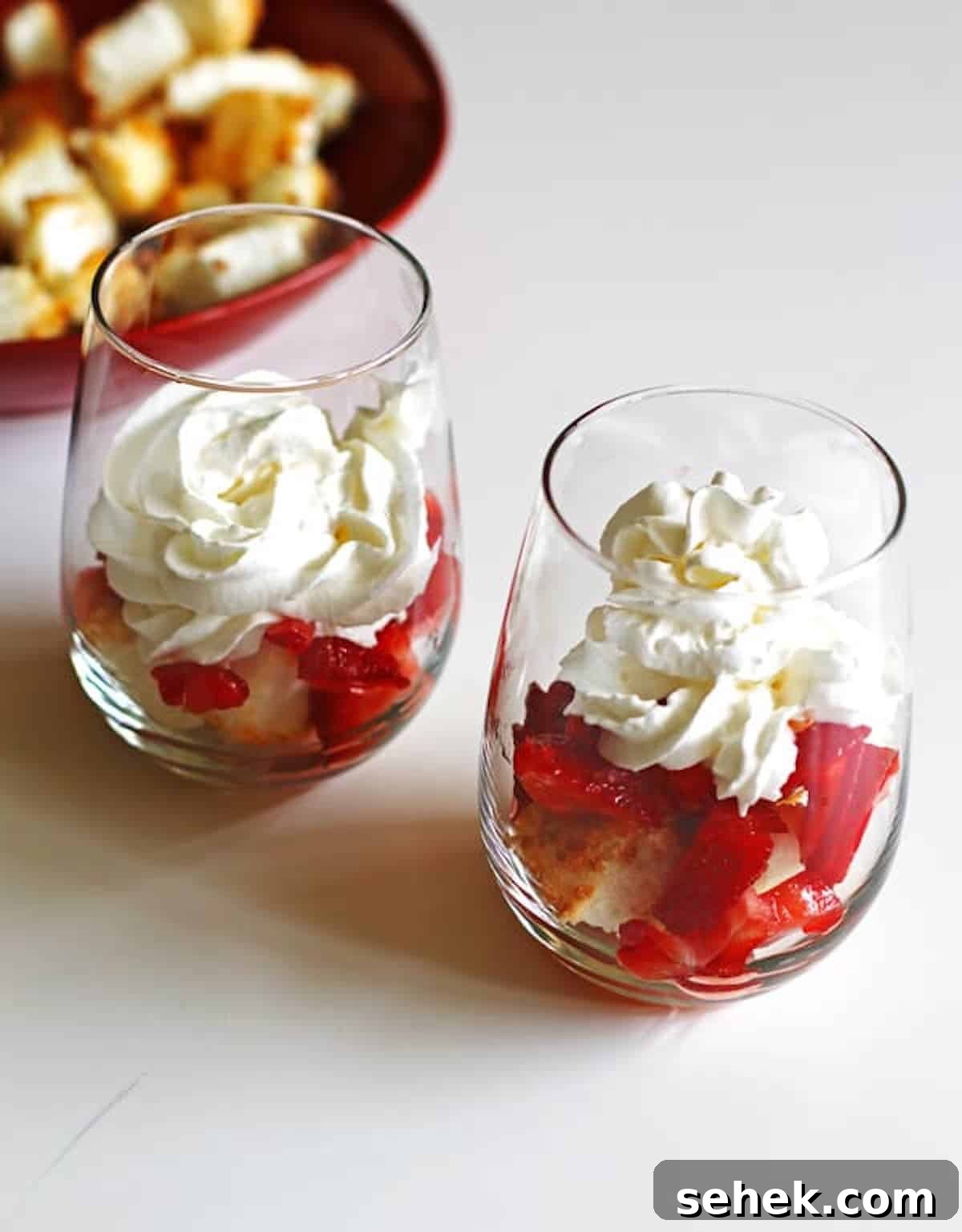 Strawberry Angel Food Shortcake with Fresh Whipped Cream 10 Toasted angel food cake cubes topped with strawberries and whipped cream in a wine glasses to assemble strawberry shortcakes.