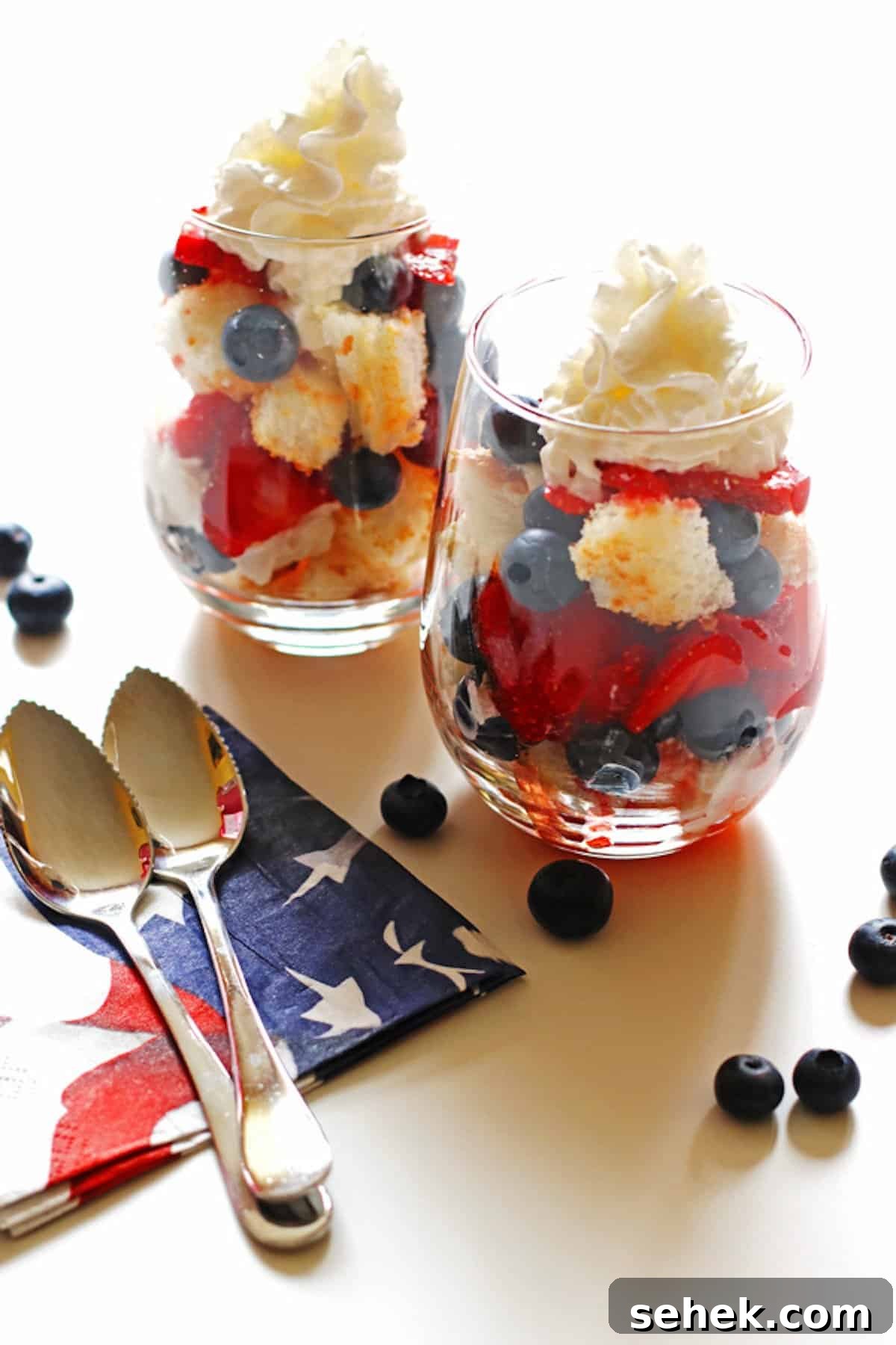 Strawberry Angel Food Shortcake with Fresh Whipped Cream 12 Red white and blue strawberry shortcakes with blueberries and strawberries.