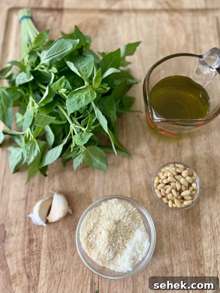 Trofie al Pesto Genovese with Potatoes and Green Beans 5 Pesto genovese ingredients on cutting board.
