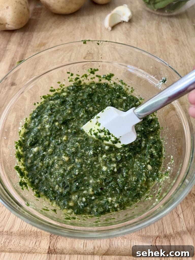 Trofie al Pesto Genovese with Potatoes and Green Beans 9 Stirring grated cheese into basil mixture with small spatula.