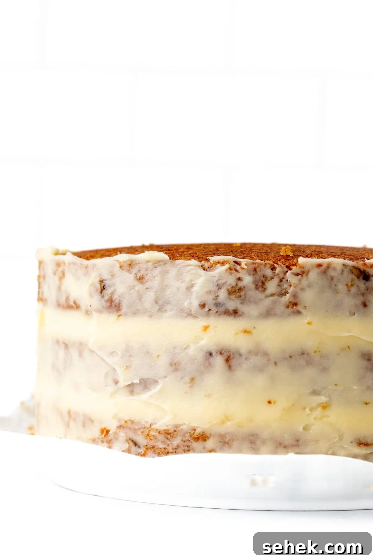 Layered Carrot Cake with Cream Cheese Frosting 7 3 layer carrot cake with crumb coat of cream cheese frosting