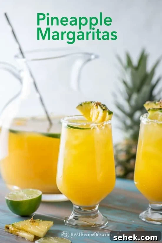 Best Pineapple Margaritas Recipe in Pitcher for Parties | BestRecipeBox.com Best Pineapple Margaritas Recipe in a glass