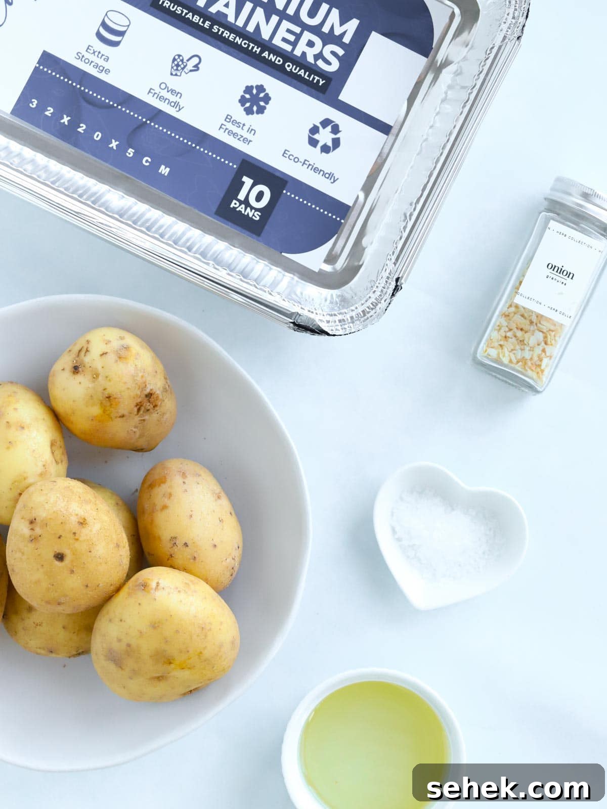 Crispy Roast Potatoes: Foolproof Oven Recipe for Golden Crunch 4 Easy Roast Potatoes recipe ingredients all laid out on a counter.