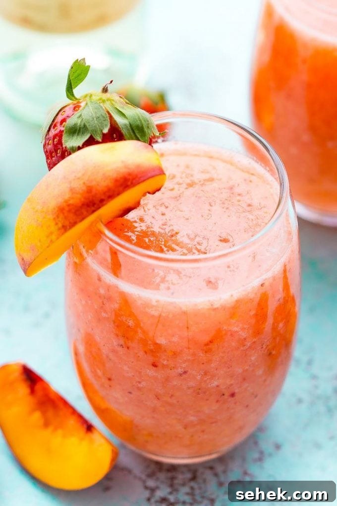 40+ Refreshing Summer Cocktail Recipes for Parties and Picnics 3 Strawberry Peach Wine Slushies - Over 40 of the BEST Summer Cocktails