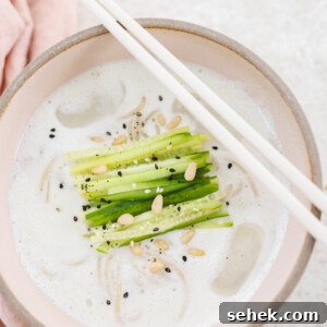20+ Simple Vegan Soup Recipes for Every Season 23 a bowl of kongguksu with chopsticks on top