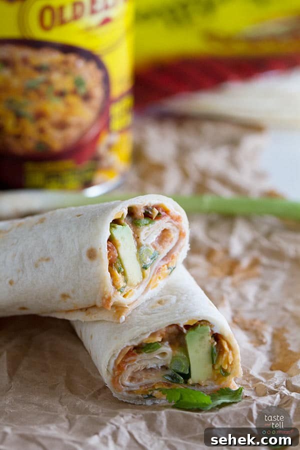Cheesy Bean Vegetarian Wraps: Flavorful Lunch or Snack 2 These Vegetarian Wraps with Beans and Cheese make the perfect grab and go lunch. Filled with cream cheese, refried beans, cheese, salsa, green onions, cilantro and avocado, they will make your taste buds happy!